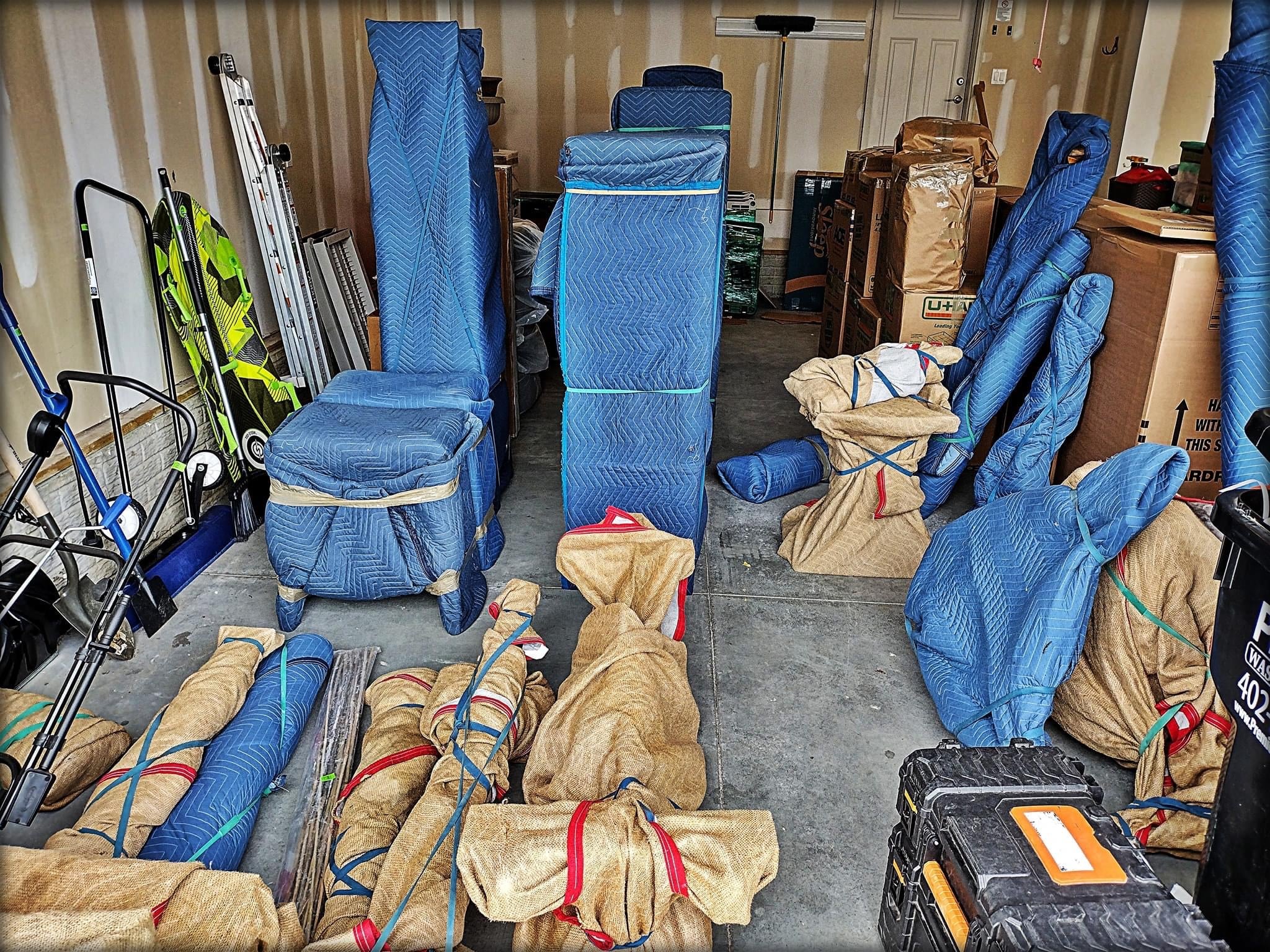 Inside a storage space, loaded with packed belongings.